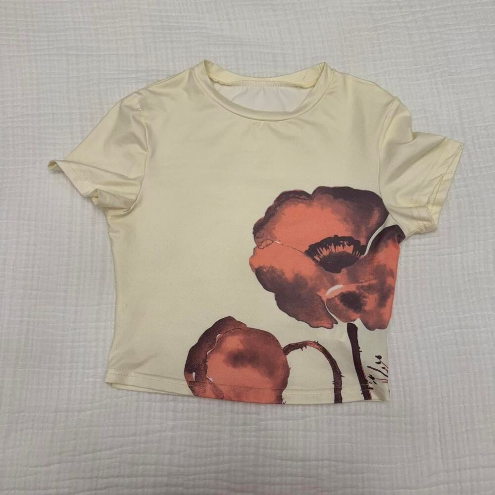 cream floral graphic cropped baby tee